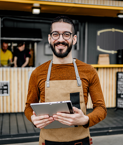 cafe owner in front of establishment, section 179 and bonus depreciation